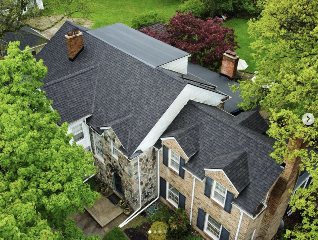 A large house with many trees and bushes