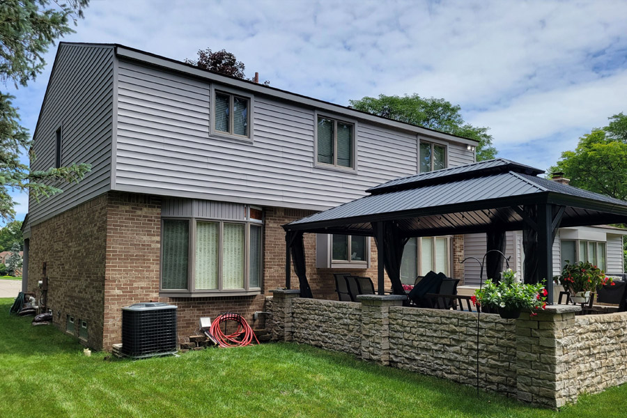 A house with a patio and covered porch.