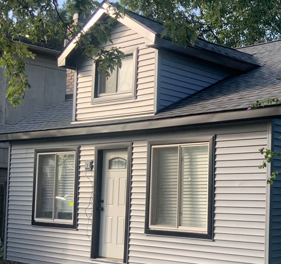 A house with a white door and windows.