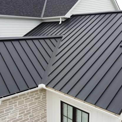 A black metal roof on top of a house.