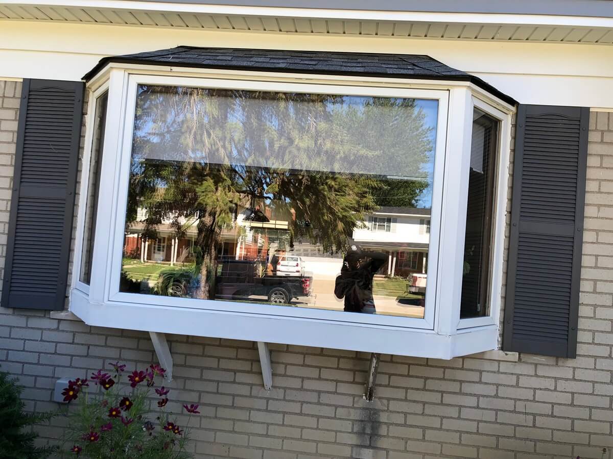 A window that is open on the outside of a house.