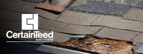 A close up of the roof of a house with debris on it