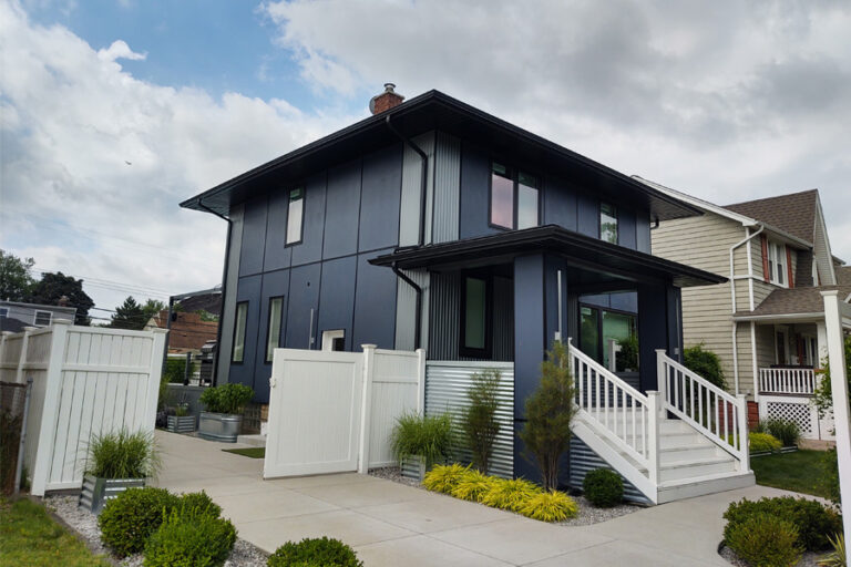 James Hardie Siding with black accent overhangs and seamless gutters