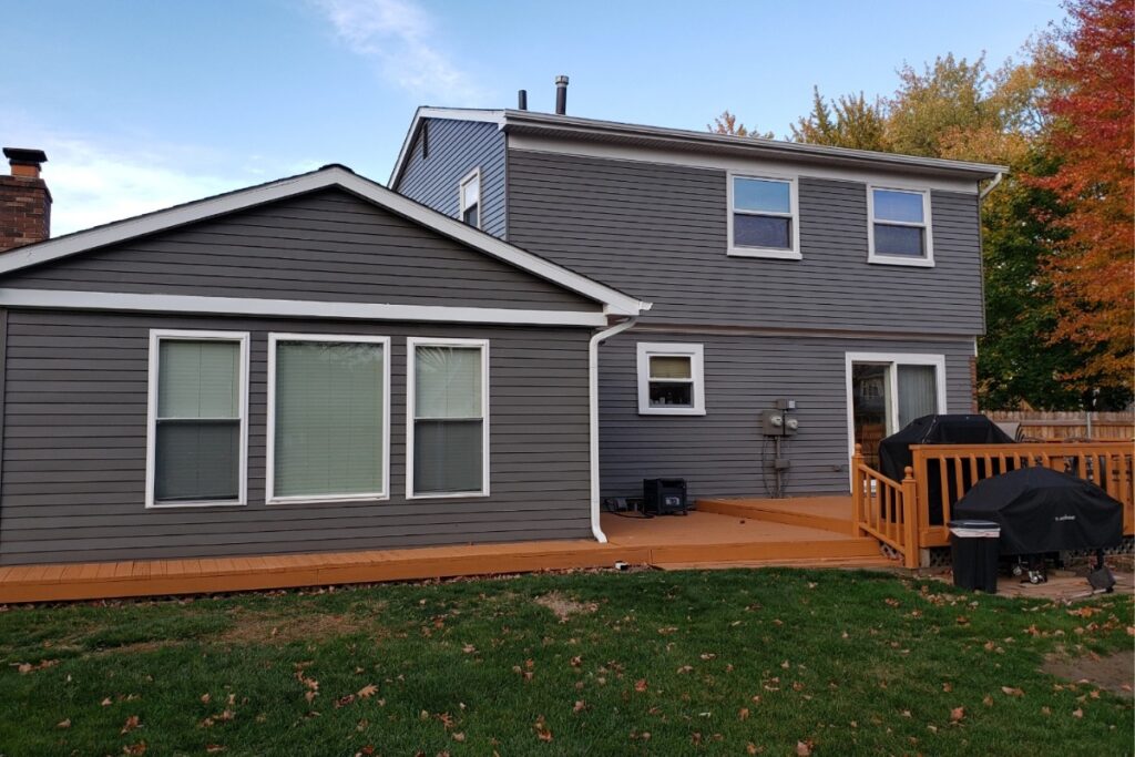 Seamless gutter installation on a luxury home