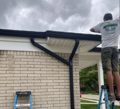 Our seamless gutter machine arrives at your troy driveway on install day 1