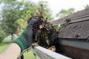 3G Home Exteriors crew installing leaf protection on gutters in Detroit Michigan