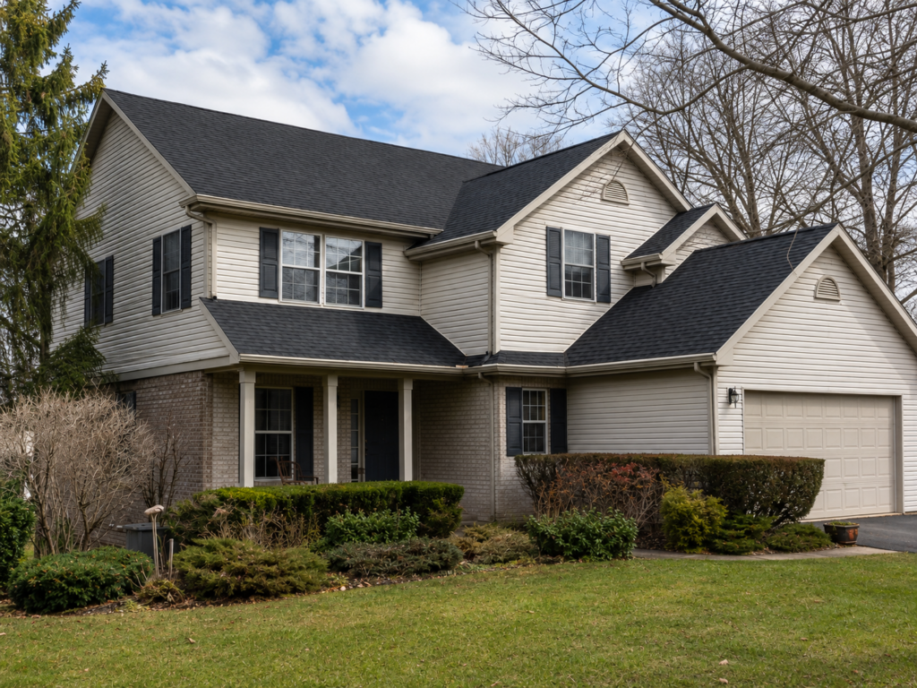 After view of a completed asphalt shingle roof with renewed flashing and finished transitions