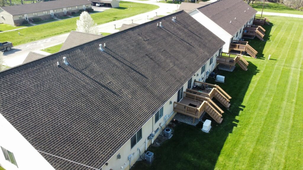 Aerial view completed dark shingle roof