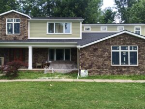 Front exterior of a residential home prepared for a James Hardie siding project