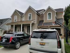 Front view of a residential home with newly installed copper gutters