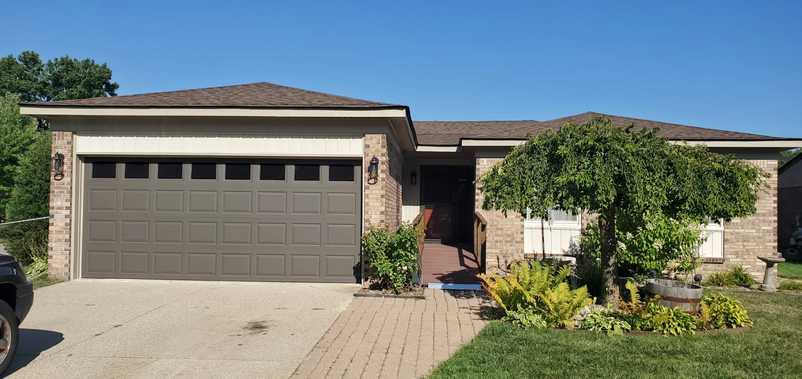 Completed gutter soffit and siding work on Metro Detroit home