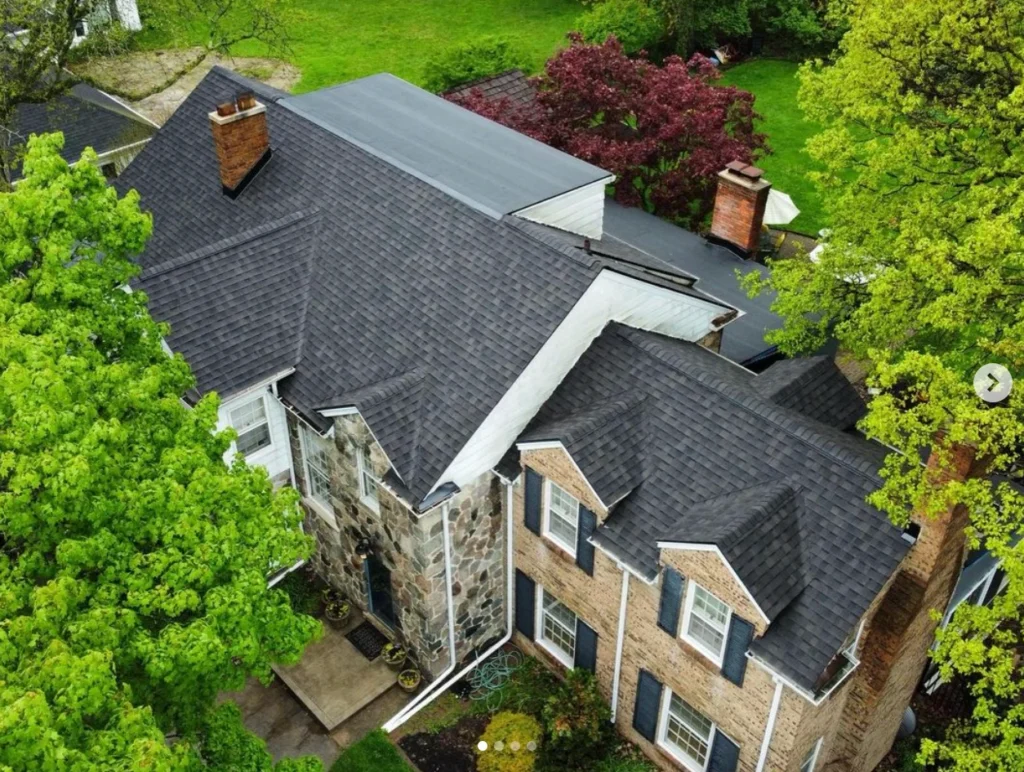 A large house with many trees and bushes