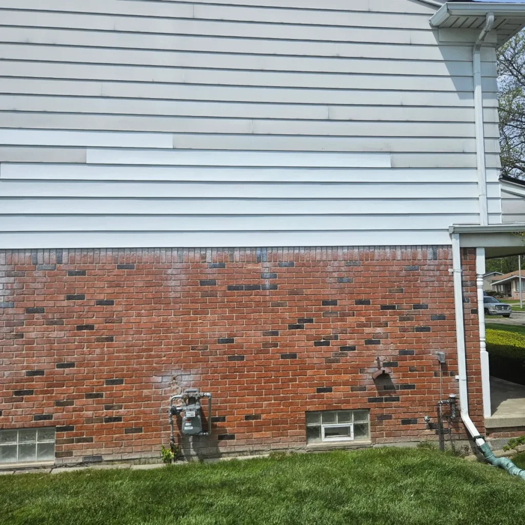 Wind damaged siding repaired on a Metro Detroit home